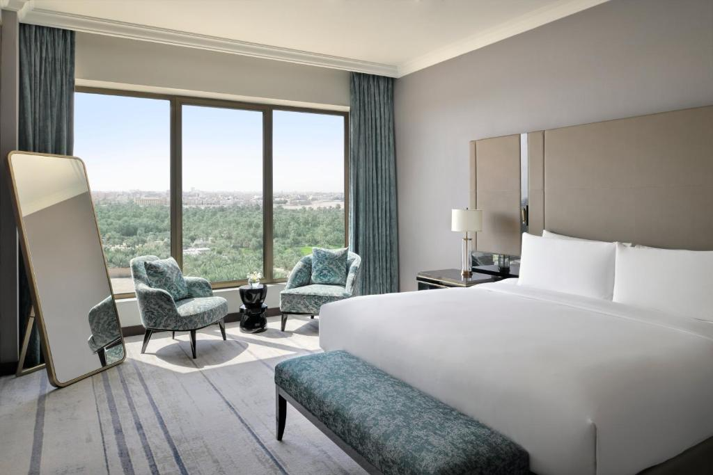freepik__photo-a-luxurious-hotel-room-with-a-large-bed-two-__48921