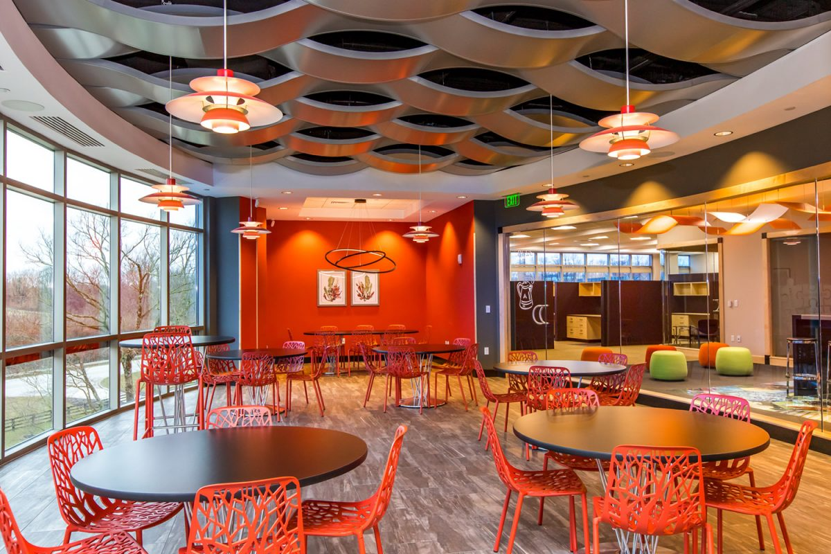 freepik__photo-a-modern-cafeteria-with-orange-chairs-and-ta__55646